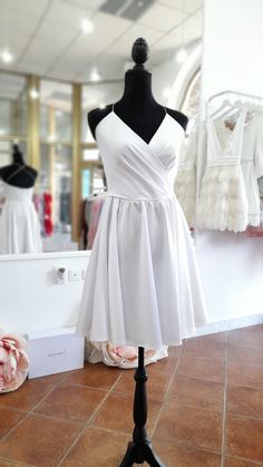 a white dress on display in a store