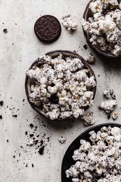 three bowls filled with cookies and marshmallows