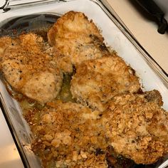 three pieces of fried meat in a glass dish