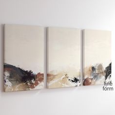 three abstract paintings hang on the wall next to each other