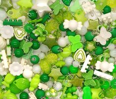 many green and white beads are grouped together