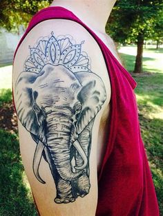 an elephant with a crown on it's head is shown in this tattoo design