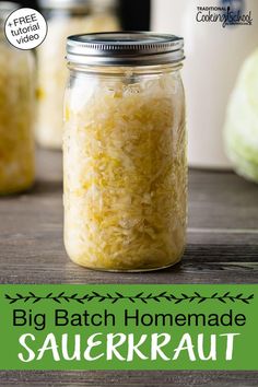 a jar filled with sauerkraut sitting on top of a wooden table