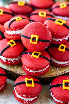 red and yellow decorated cookies are on a plate