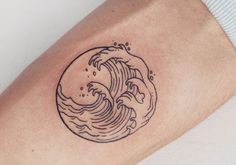 a small wave tattoo on the arm