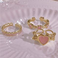 This Ring Set Is Gorgeous And Elegant 3 Rings Set Of 3 Simple Heart Shaped Rhinestone And Cat's Eye Stone Open Ring Set Size 8 Gorgeous Gold Tone Perfect Stackable Rings If You Frequently Visit My Closet You Probably Know I Love Unique Finds! This Sure Is That! I Love These ! Free Gift With Every Order Packages Ship Same Or Next Day All Prices Are Negotiable Smoke/Pet Free Home All Sales Are Final Stay Dreamy And Always Embrace Your Beautiful Xo Jaime Gold Ring Pack, Lovecore Rings, Coquette Rings, Alice In Wonderland Costume, Unique Finds, Cats Eye Stone, Cat Ring, Rings Set, Eye Stone