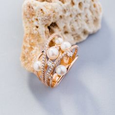 Natural pearl ring made of solid 14k gold. - 14k gold - the widest part of the ring = 16.6 mm - natural pearls 4? 5 and 6 mm in diameter - Cubic zirconia Free gift box. Express shipping with DHL (3-6 business days). This ring can also be made in 18k gold. If you want to replace cubic zirconia with precious stones please write us, and we'll calculate the cost with the gems you want. See more at our shop https://www.etsy.com/shop/JewelryEscorial Join our Instagram account: https://www.instagram.co Pearl Gold Ring, Lotus Flower Ring, Natural Pearl Ring, Floral Wedding Bands, Gold Ring For Women, Flower Engagement Ring, Filigree Design, Natural Pearl, Blue Topaz Ring