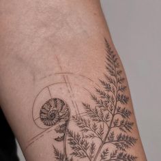 a close up of a person's arm with a tattoo on it