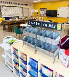 a classroom filled with lots of different colored bins