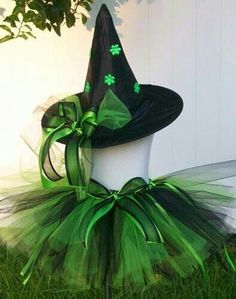 a black hat and green tutu with shamrocks on it