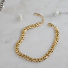 "Beautiful Curb Chain bracelet featuring pave cubic zirconia stones throughout the bracelet. Bracelet can also be worn on reverse side, where there are no stones. Very versatile and looks great worn alone or paired with other bracelets! - - - D E T A I L S - - - * Thick plating of 14k Gold or Rhodium over brass * Two Sizes Available 6.25\" or 6.75\" + .5\" Extension Chain * 6mm wide * Lobster Clasp Closure * Highest Grade CZ stones for an authentic diamond look Made with 100% Pure Love ♡♡ Comes Cubic Zirconia Jubilee Link Bracelet, Adjustable Cubic Zirconia Chain Bracelets, Adjustable Chain Bracelet With Cubic Zirconia, Cubic Zirconia Curb Chain Bracelet Gift, Gift Curb Chain Bracelet With Cubic Zirconia, Chain Link Bracelet Silver, Cuban Link Bracelet, Curb Chain Bracelet, Gold Chain Bracelet