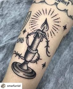 a black and white tattoo with a candle on it