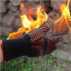 a pair of gloves sitting on top of a fire