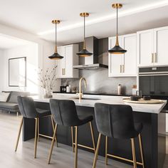 a kitchen with white cabinets and black bar stools next to an island in the middle