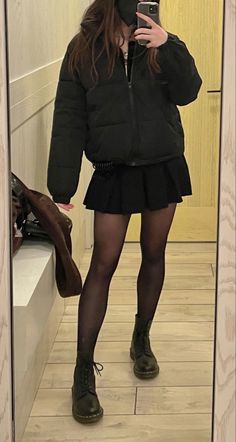 Black puffer jacket skirt and Doc martins mirror selfie Winter Black Jacket Outfit, Clothes Closet Aesthetic, Black Puffer Coat Outfit, Puffer Jacket Outfit Aesthetic, Outfits With Puffer Jackets, Mini Skirt Outfit Winter