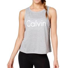 Cropped Tank From Calvin Klein Performance With Racer-Stripe. Dropped Armholes, Cropped Shape, Hits Above Waist, Drop Arm Openings, Stripes At Sides; Polyester/Rayon Machine Washable Summer Sports Top With Contrast Stripes, Summer Sports Tops With Contrast Stripes, Casual Stretch Tops With Contrast Stripes, Casual Sleeveless Top With Contrast Stripes, Spring Stretch Tops With Contrast Stripes, Spring Tops With Contrast Stripes And Stretch, Striped Athleisure Tops For Sports, Spring Striped Sports Tops, Striped Athleisure Tops