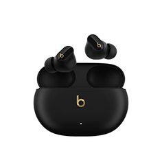 the beats by dr dre earbuds are black and have gold details on them