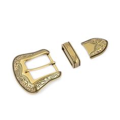 two gold buckles and one with a decorative design on the front, both in different sizes