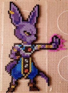 a pixellated image of a purple bunny holding a pink object in it's right hand