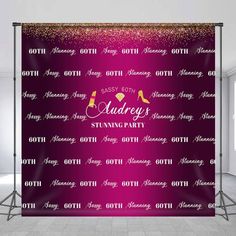 the backdrop for an event with pink and gold glitters