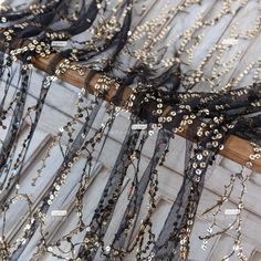 several different types of beaded and sequins on fabric