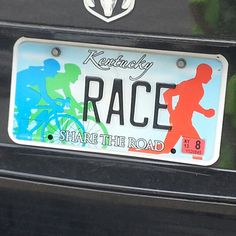 a license plate that says kentucky race share the road with a running man on it