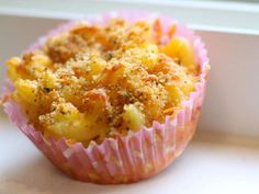 a muffin sitting on top of a window sill