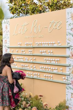 a woman standing in front of a sign that says let's run - eee