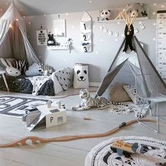 a child's bedroom decorated in black and white