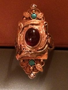 "Fine jewelry from the Turn of the Century. Stunning example of Victorian artistry at it's finest. The detail work present in this 14k yellow & rose solid gold handmade antique ring is superb. High quality center cabochon stone that I believe is a garnet. Size 5 1/4. Length 1 1/4\" x Width 1/2\". Part of a collection currently being sold." Ceremonial Oval Cabochon Rings, Antique 14k Gold Signet Ring With Cabochon, Luxury 14k Gold Ruby Cabochon Ring, Luxury Rose Gold Cabochon Rings, Victorian Gold Signet Ring With Gemstone, Antique Rose Gold Jewelry For Ceremonial Occasions, Heirloom Gold Signet Ring With Cabochon, Gold Heirloom Signet Ring With Cabochon, Unique Oval Signet Ring Collectible