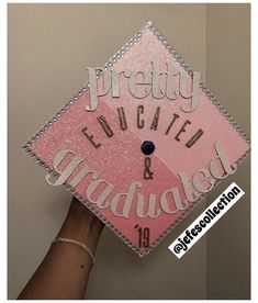 a pink and silver graduation cap with the words pretty expect & annotated on it