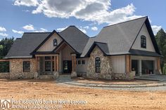 a large house with stone and shingles in the front yard