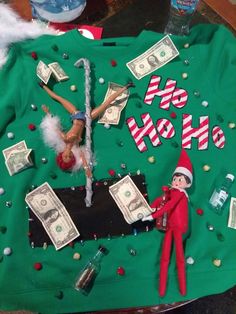 an elf is on top of a green shirt with money and cash bills around it