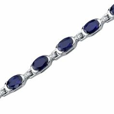 Featuring a Oval Cut Blue Sapphire this Bracelet is crafted out of Sterling Silver. Free Shipping and Factory Direct Prices. Style SB3704 Sapphire Tennis Bracelet, Jewelry Questions, Blue Sapphire Bracelet, Blue Topaz Bracelet, Blue Sapphire Gemstone, Classic Bracelets, Silver Gemstone Jewelry, Sapphire Bracelet, Round Stud Earrings