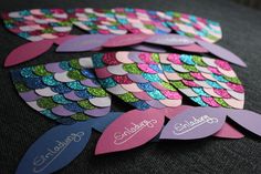 colorful paper cut outs with name on them