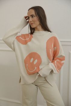 happy face sweatshirt with an oversized fit, long sleeves and side slits Trendy Crew Neck Sweater, Trendy Crew Neck Soft Knit Sweatshirt, Cute Oversized Sweater For Loungewear, Spring Soft Knit Sweatshirt, Spring Crew Neck Comfortable Sweater, Trendy Soft Knit Cotton Sweater, Casual Spring Sweatshirt With Soft Knit, Comfortable Crew Neck Sweater For Spring, Casual Spring Soft Knit Sweatshirt