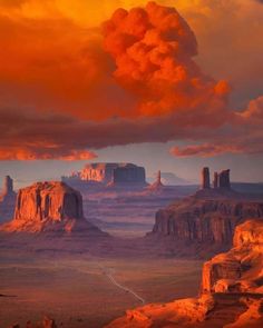 an image of the desert at sunset with clouds in the sky