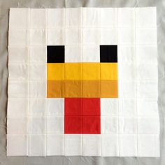 the block is made up of squares with different colors and shapes on it's sides