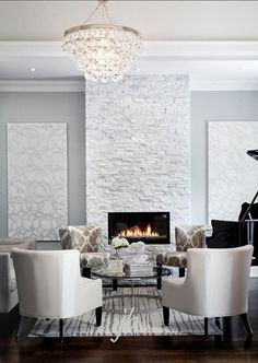 a living room filled with furniture and a piano in front of a fire place on the wall