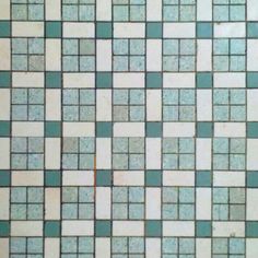 a close up view of a tiled floor with blue and white tiles on it's sides