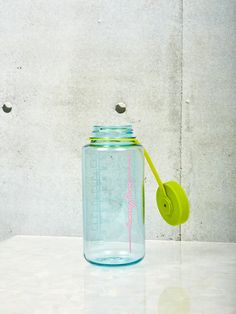 A large seafoam Nalgene by Coming Soon with chartreuse lid and pink Coming Soon logo. Sport Art Direction, New Coming Soon, Nalgene Water Bottle, Workout At The Gym, Clear Bottle, New Coming, Sport Art, Water Bottle Design, Kitchen Inspo