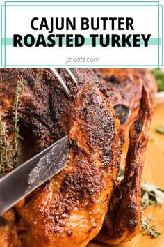 a close up of a roasted turkey on a cutting board with the words cajun butter roasted turkey