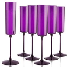 five purple wine glasses lined up in a row