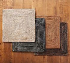 four different types of rugs laid out on a wooden floor