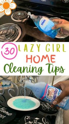 a woman is cleaning her stove top with blue liquid and water in the bowl next to it