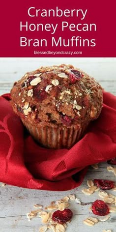 cranberry honey pecan bran muffins on top of a red cloth