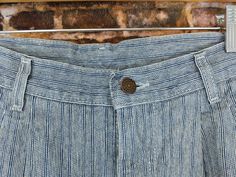 "These vintage pants are made by Lee from a blue and white striped material. They are marked a size 12 Petite but should fit closer to a modern size Medium (consult the measurements to ensure a good fit). They have only very light wear. waist size 30\" hip size 44\" inseam 27.5\" rise 12.5\" 0225" Pinstripe Cotton Straight Leg Bottoms, High Waist Pinstripe Cotton Bottoms, Fitted Striped Bottoms With Belt Loops, Cotton Tapered Leg Bottoms With Vertical Stripes, Cotton Bottoms With Vertical Stripes And Tapered Leg, Pinstripe Tapered Leg Cotton Bottoms, Pinstripe Cotton Tapered Leg Bottoms, Pinstripe Cotton Bottoms With Tapered Leg, Vintage Striped Straight Leg Bottoms