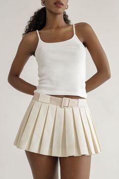 This skirt will be on repeat in your wardrobe. A crisp, fresh take on the micro mini with built in bloomers. You can pair this with practically anything.Features an invisible side zipper and built in fabric covered belt for a pop of color.These perfect pleats stay flat. Low waist skirt that sit below the navel. Hits at the hip for that micro mini length. Skirt grazes your upper thigh.Cotton / Poly blend. Dry Clean Only.Made in New York City. Orseund Iris, Low Waist Skirt, Belted Mini Skirt, Micro Mini Skirt, Cardigan Sweater Jacket, Skirt Belt, Micro Mini, Crop Top Blouse, Boho Maxi Dress