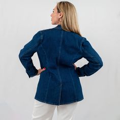 Discover the perfect blend of casual and polished with our chic structured denim blazer. Designed for the fashion-forward woman, this versatile denim jacket offers a sophisticated silhouette with notched lapels and a contemporary tailored fit. It's an ideal piece for those seeking a casual sophisticated denim blazer that transitions effortlessly from day to night. Notch Lapel Denim Jacket For Workwear, Formal Denim Blazer For Spring, Spring Formal Denim Blazer, Tailored Denim Blazer With Button Closure, Classic Denim Button-up Blazer, Fitted Denim Blazer With Lapel Collar, Classic Single Breasted Denim Blazer, Tailored Denim Outerwear With Notch Lapel, Tailored Denim Notch Lapel Outerwear