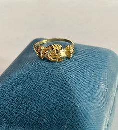 "This beautiful & unique Gimmel ring is very substantial. Beautiful details along the cuffs and the outside of the ring. Detailed cuffs have an orange blossom/ forget-me-not floral design symbolic and often used in vintage/antique wedding jewelry. Hands are nicely carved both upper and lower. Band is sleek . History tells us that the two rings were often parted and one was given to each of the betrothed until they were reunited at marriage. It is not uncommon to find a gimmel ring either par Victorian 14k Gold Diamond Cut Rings, Hallmarked Yellow Gold Engraved Collectible Ring, Antique 14k Gold Jewelry For Promise Ring, Antique 14k Gold Promise Ring, Antique Yellow Gold Jewelry For Promise Ring, Antique Diamond Cut 14k Gold Rings, Antique Yellow Gold Promise Ring, Antique Yellow Gold Diamond Cut Ring, Victorian 14k Gold Engraved Collectible Ring